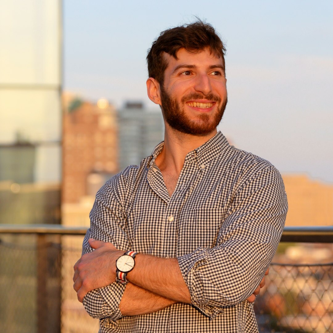 Portrait of man with beard smiling professionally