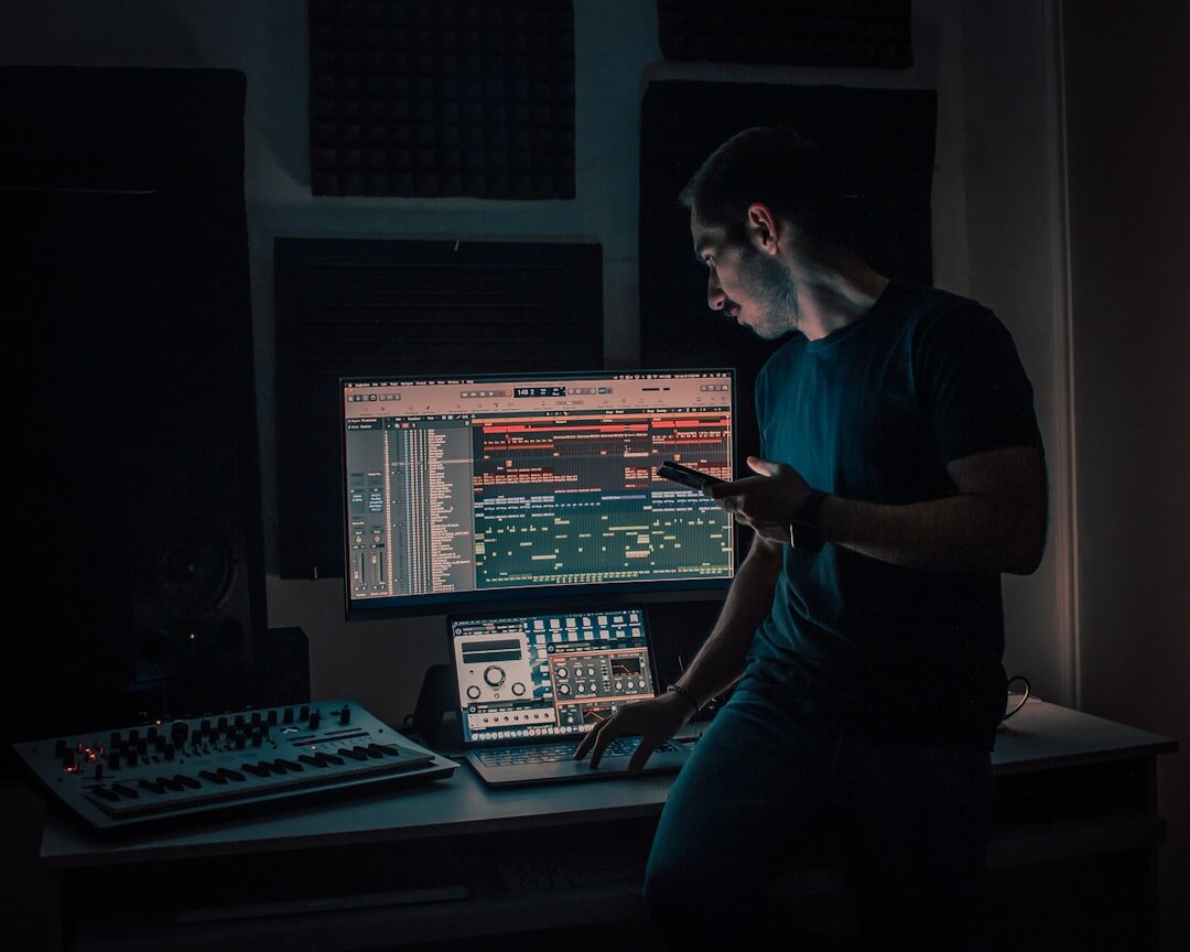 Podcast host recording audio content with microphone in dark studio